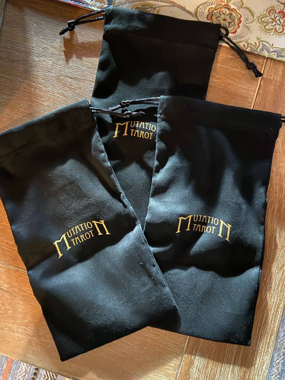 ultra suede bags with Mutation Tarot logo